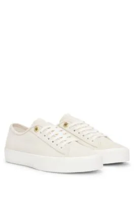 Suede lace-up trainers with branded eyelets