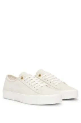 Suede lace-up trainers with branded eyelets